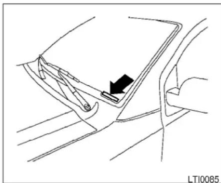 Line drawing of a car interior showing a seatbelt and hand handle (no text or symbols)