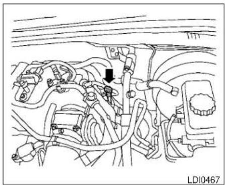 Technical line drawing of an engine bay with hoses and a black arrow indicating a component (no text or symbols present)