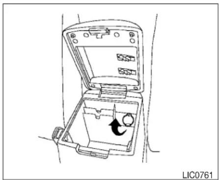 Diagram of a device interior showing an open case with a circular component and directional arrow (no text or symbols)