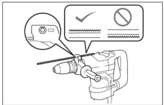 Diagram showing a hand operating a drill bit with checkmark and no-smoking symbols, accompanied by an icon of a device with a magnified view.