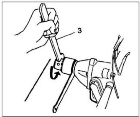 Technical diagram showing a hand using a wrench to adjust a mechanical component with labeled parts 3 and an arrow indicating rotation.