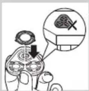 Diagram showing a hand holding a tool with a magnified view of a gear and a crossed-out gear symbol, indicating mechanical or electrical hazard.