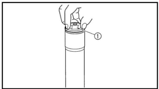 Diagram showing a hand holding a cylindrical object with a numbered label pointing to it, likely illustrating a mechanical or electrical component.