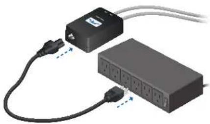 Two electronic devices connected by wires, one with a power outlet and the other with multiple ports (no visible text or symbols)