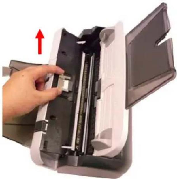 Hand inserting a card into a printer case, showing internal components and a red upward arrow (no text or symbols)