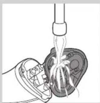 Diagram of a hand pouring liquid into a mechanical component (no text or symbols visible)