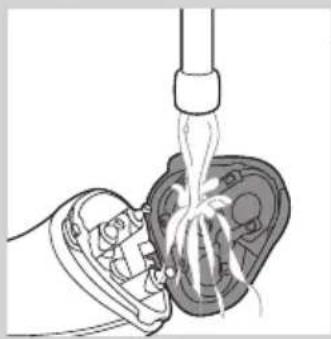 Illustration of a hand inserting hair into a device with a piping bag above (no text or symbols)