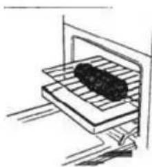 Simple line drawing of a tray with a dark object inside, no text or symbols present