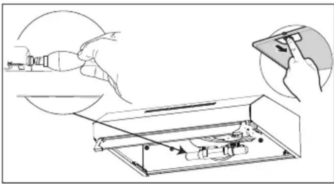 Diagram illustrating a hand using a tool to adjust or install a device, with an inset showing the process.