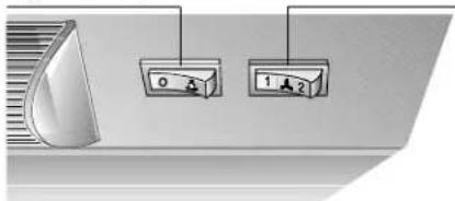 Diagram showing two labeled control buttons with icons and numbers, likely for vehicle or industrial control.