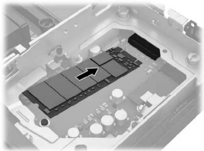 Interior view of an electronic device showing a circuit board with an arrow pointing to a component (no text or symbols visible)
