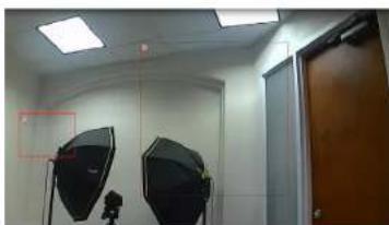 Interior view of a photography studio with two studio lighting equipment (no visible text or symbols)