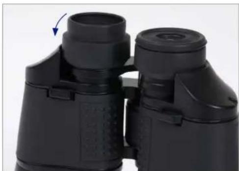 Close-up of two black binoculars with a blue arrow indicating rotation (no text or symbols visible)