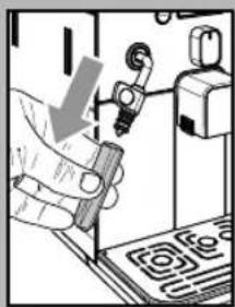 Hand holding a device with a downward arrow, next to a circuit board (no visible text or symbols)