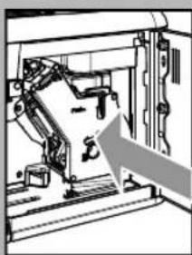 Mechanical assembly diagram showing a robotic arm inside a frame with an arrow indicating motion direction (no text or symbols)