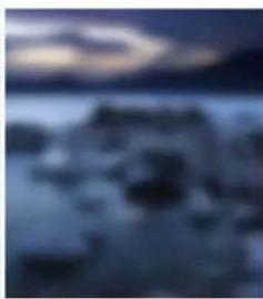 Blurred night sky with indistinct dark shapes and no visible text or symbols