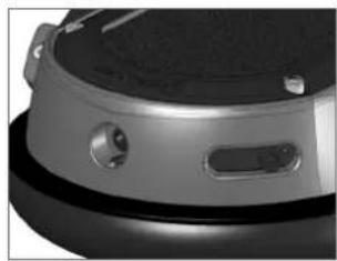 Close-up of a robotic device with a circular head and control buttons (no visible text or symbols)