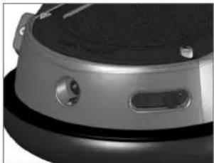 Close-up of a robotic device with circular ports and a black handle (no visible text or symbols)