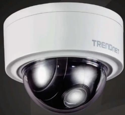 Close-up of a white TREAD NET security camera with visible lens and sensor array (no text or symbols on device body)