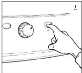 Hand holding a circular object with a pointer, against a horizontal surface (no text or symbols)