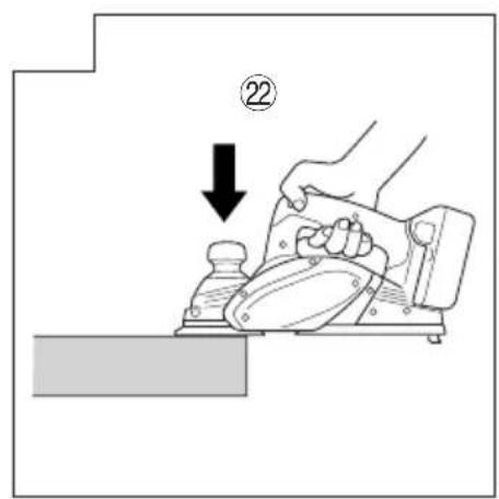 Diagram showing a hand using a power tool to lift a component, with a numbered label (22) pointing to the process.