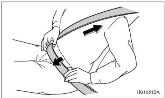 Illustration of a person adjusting a seatbelt with arrows indicating motion (no text or symbols)