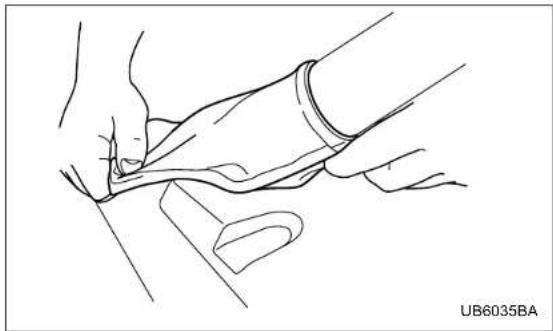Line drawing of a hand performing a medical or therapeutic procedure on a patient's arm (no text or symbols)