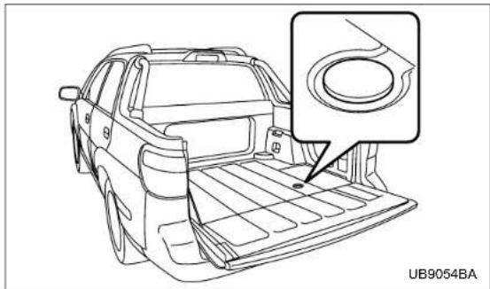 Line drawing of a car rear bumper with a circular component inserted, no text or symbols present