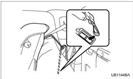 Diagram showing a car interior with a close-up of a hand using a clip switch to adjust the seatbelt (no text or symbols present)