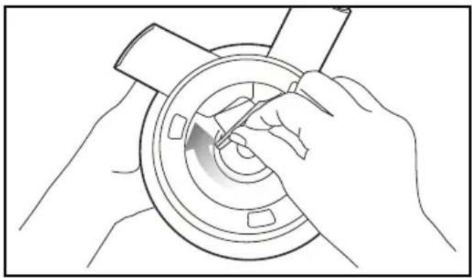 Line drawing of hands using a tool to adjust or install a circular component (no text or symbols visible)