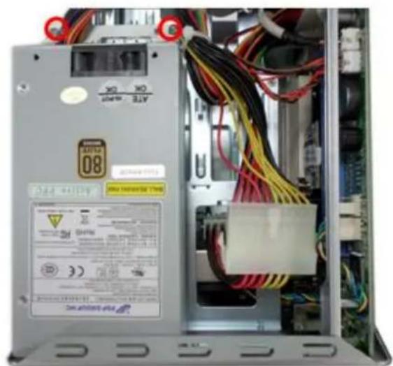 Interior view of an electronic equipment cabinet showing wiring, connectors, and a central circuit board (no readable text or symbols)