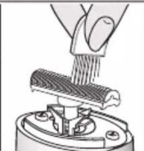Illustration of a hand using a tool to lift a textured cylindrical object into a mechanical component (no text or symbols visible)