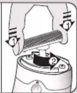 Diagram showing a hand pressing down on a mechanical component with numbered parts labeled 1 and 2.