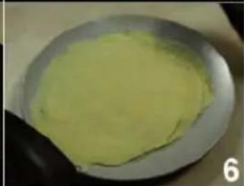 Close-up of a green, smooth substance in a white bowl (no text or symbols visible)