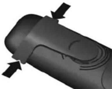 Close-up of a black mechanical component with directional arrows indicating movement or force (no text or symbols)