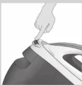 Close-up of a hand pressing down on a piece of hair into a small container (no text or symbols visible)