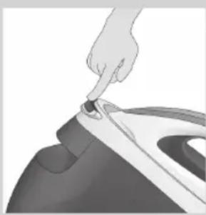 Close-up of a hand pressing down on a small mechanical component (no text or symbols visible)