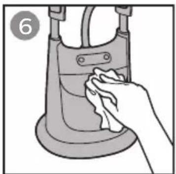 Illustration of a hand cleaning a small mechanical component (no text or symbols)