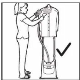 Illustration of a person using a vacuum cleaner to clean or adjust equipment (no text or symbols visible)