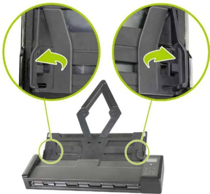 Close-up of a printer drawer with green arrows indicating internal components (no text or symbols)