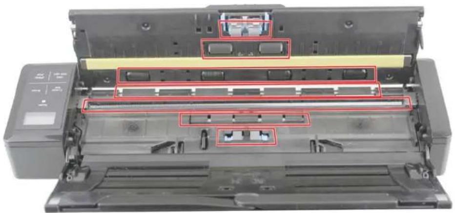 Interior view of a printer showing internal components and mounting holes (no text or symbols visible)