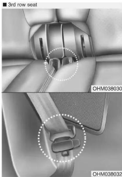 Interior view of a car showing seat assembly and belt buckle details (no text or symbols)