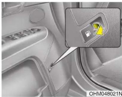 Close-up of a car interior showing the door panel and a highlighted device (no text or symbols visible)