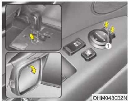 Interior view of a car dashboard with control buttons and a highlighted switch (no text or symbols visible)