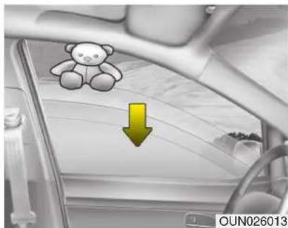 Interior view of a car with a teddy bear icon and a yellow downward arrow (no text or symbols)