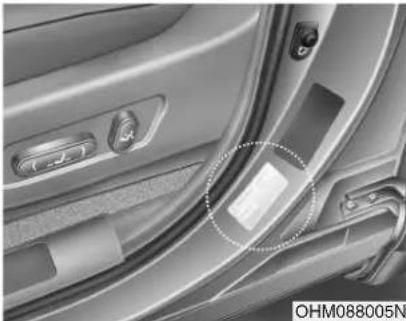 Interior view of a car showing the door, seatbelt, and dashboard (no visible text or symbols)