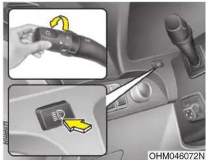 Diagram showing car control panel with rotary knob and dial indicator, plus a close-up of the dial indicator on the side panel.