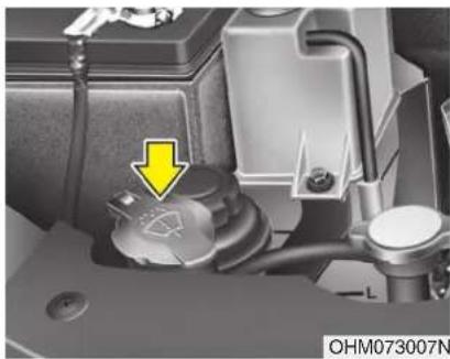 Close-up of a mechanical component with a yellow arrow pointing to a component, no visible text or symbols.