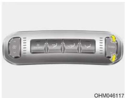 Close-up of a car climate control panel with buttons and ventilation slots (no text or symbols visible)