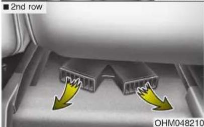 Close-up of a mechanical component with two yellow arrows indicating direction, labeled '2nd row' and 'OHM048210' (no readable text or symbols beyond labels)